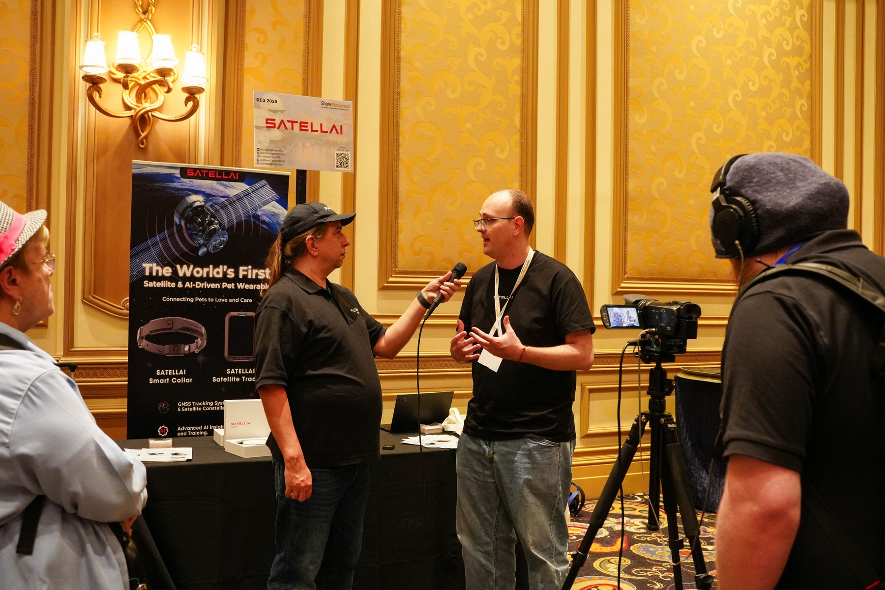 SATELLAI team presenting the satellite AI pet wearable at CES 2025.