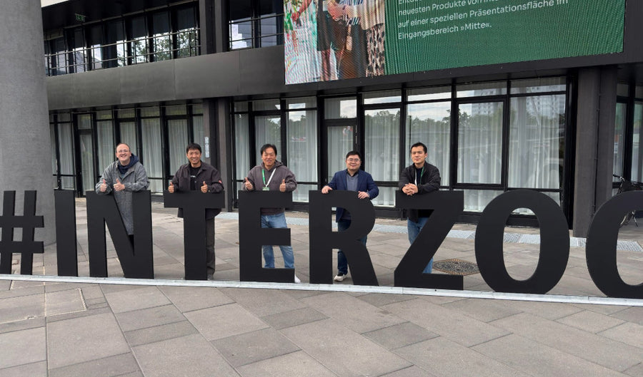 SATELLAI team members standing at the Interzoo event entrance